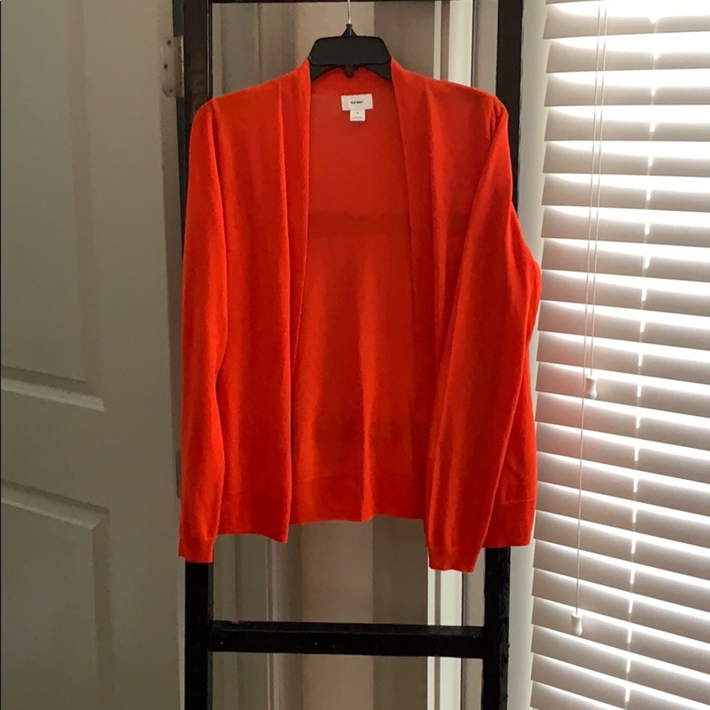 Orange cardigan.